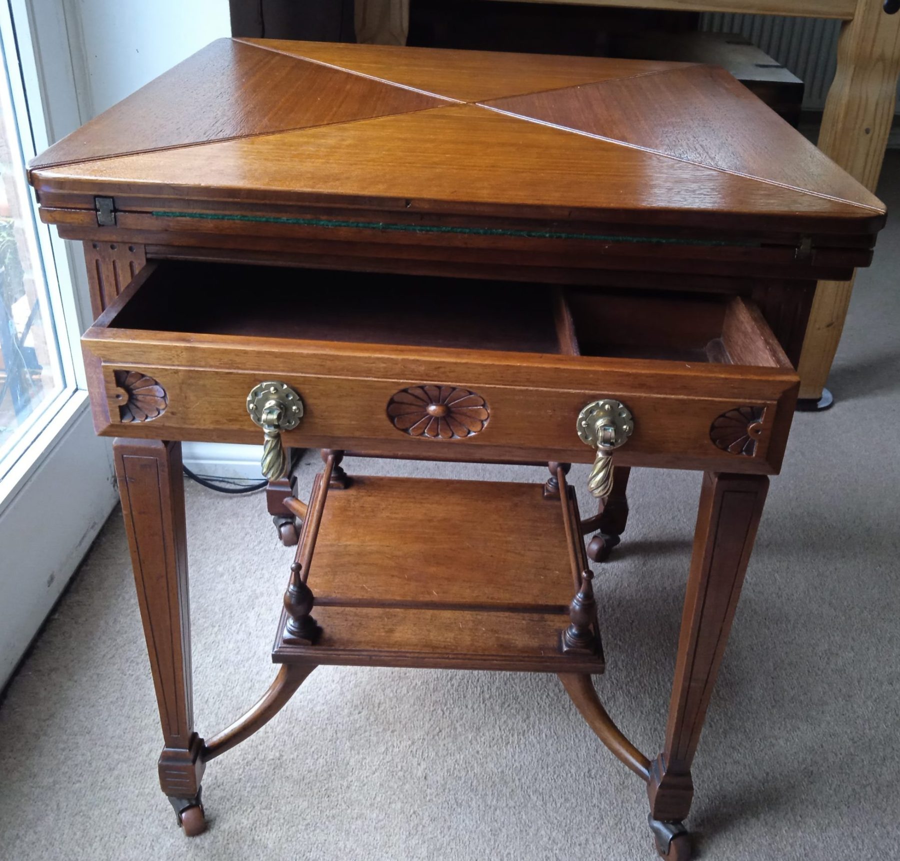 Edwardian Oak Envelope Top Card Table With Lower Galleried Tier And Green Base. SOLD.