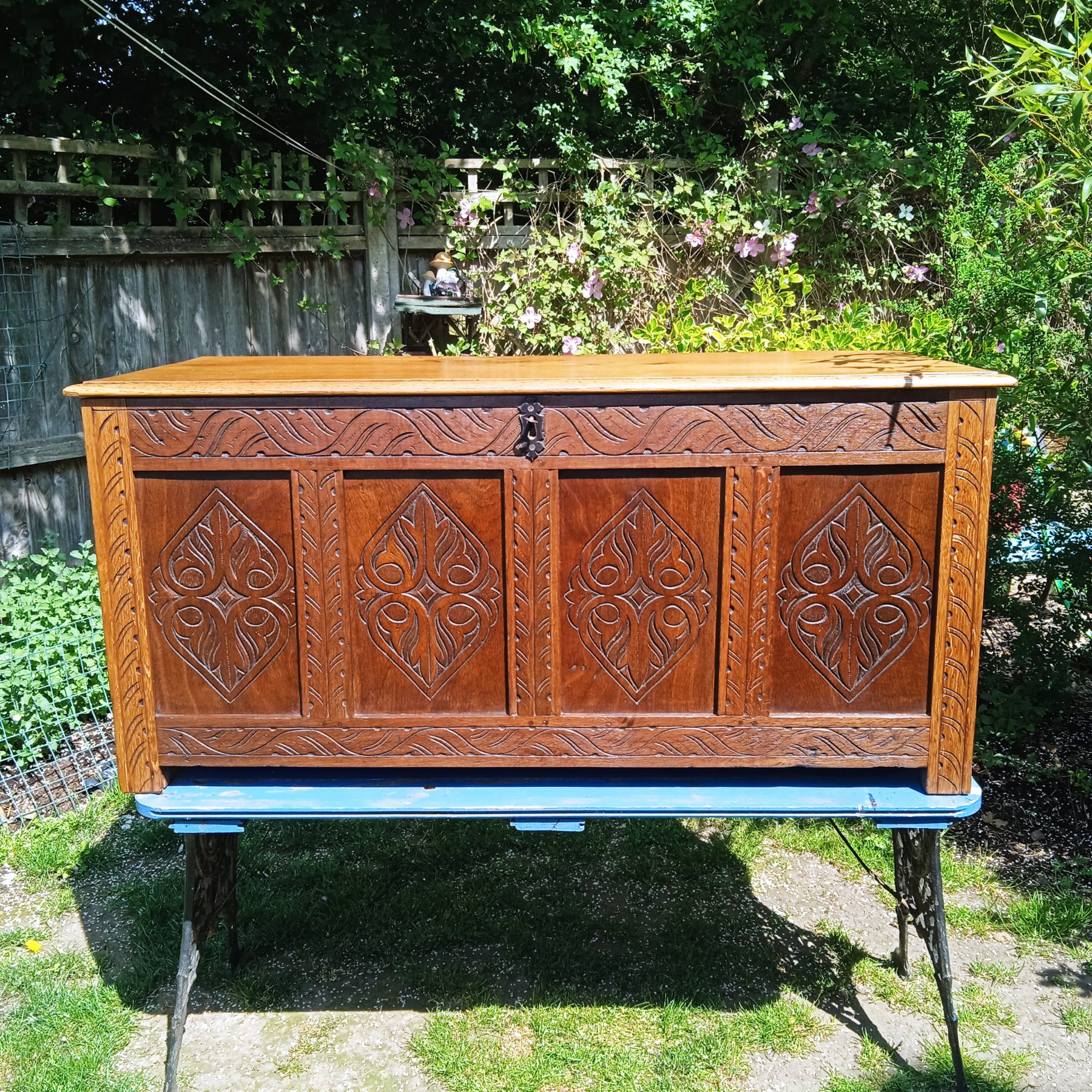A 19th Century Hand carved Oak & Mahogany 4 Panelled Coffer With Original Key.